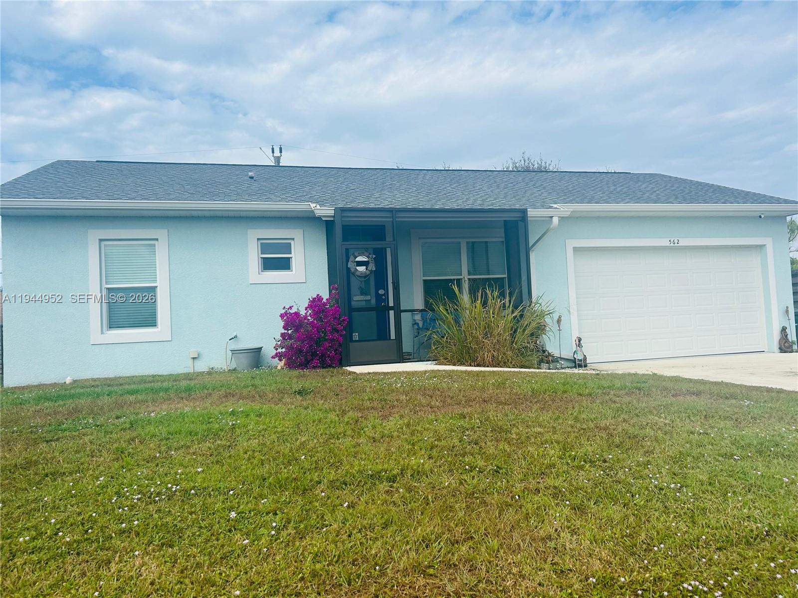 562 Flamingo Road Venice, FL 34293 - Photo 2 of 15 a view of a house with backyard and garden