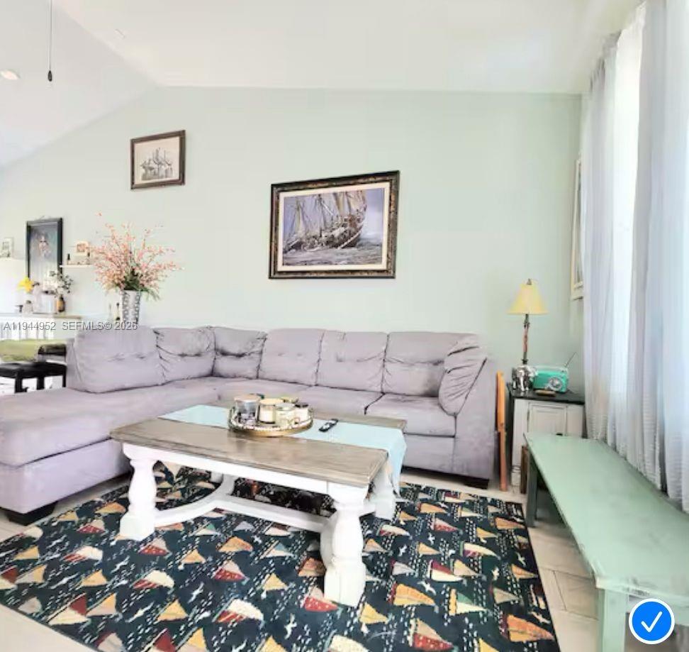 562 Flamingo Road Venice, FL 34293 - Photo 5 of 15 a living room with furniture and wooden floor