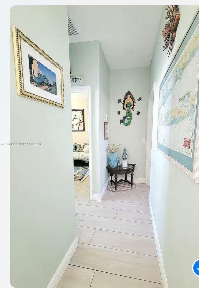 562 Flamingo Road Venice, FL 34293 - Photo 10 of 15 a living room with furniture and a table