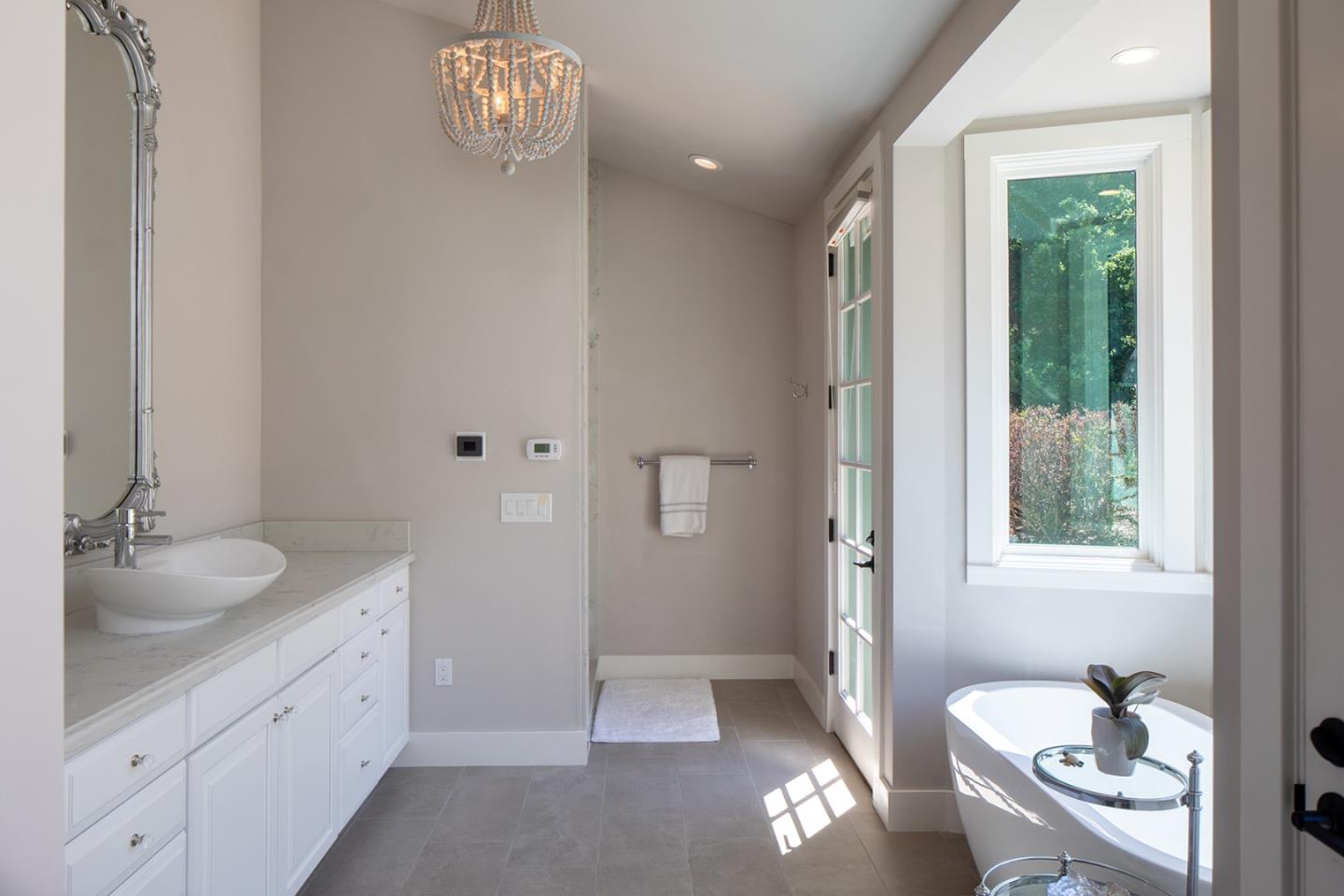 5445 Quail Way Carmel, CA 93923 - Photo 12 of 28 a spacious bathroom with a granite countertop sink and a mirror