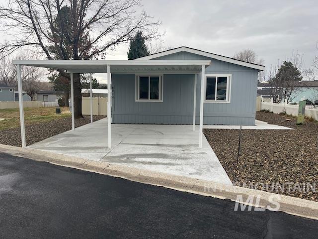 8213 Blue Ridge Lane, Unit 13 Boise, ID 83716 - Photo 1 of 23 Manufactured / mobile home with a carport