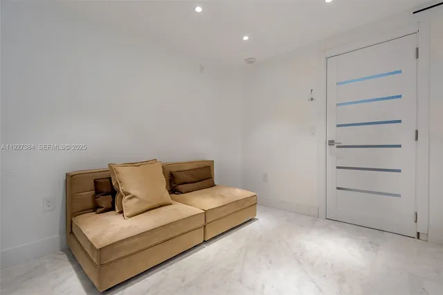 a living room with furniture and ceiling