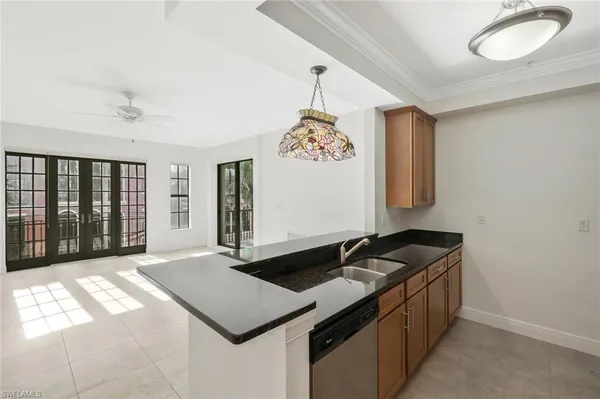 a kitchen with a stove a sink and a refrigerator