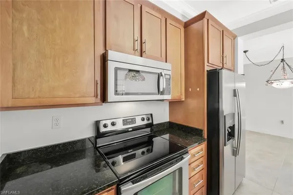 a kitchen with a stove and a microwave