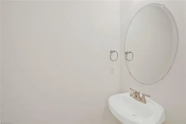 a bathroom with a sink and mirror