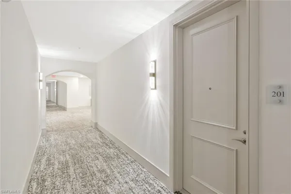 a view of a hallway with a space in a house