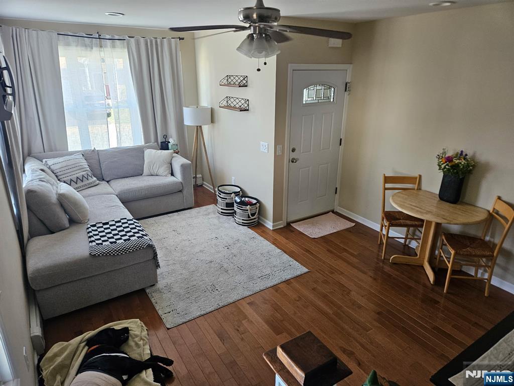 15 William Street, Unit 2 Rochelle Park, NJ 07662 - Photo 4 of 12 a living room with furniture and a wooden floor