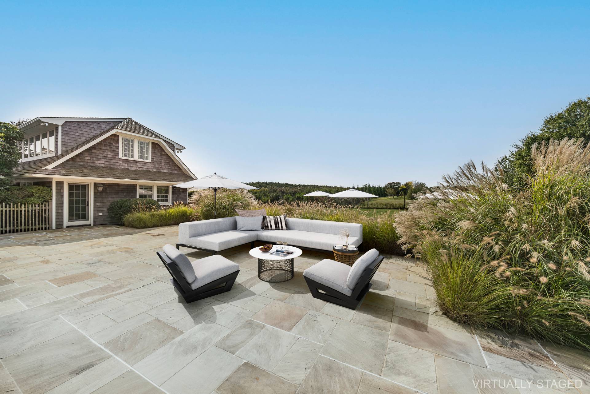 940 Deerfield Road Water Mill, NY 11976 - Photo 11 of 22 a view of a patio with couches and potted plants
