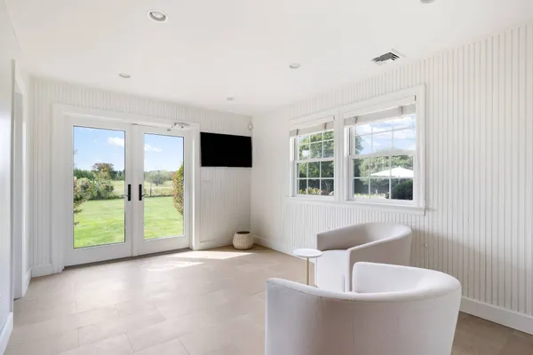 a living room with furniture and a large window