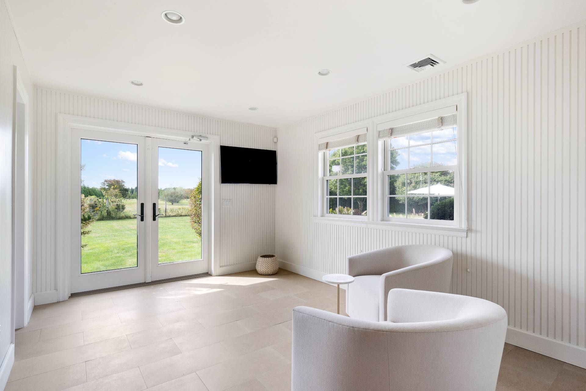 940 Deerfield Road Water Mill, NY 11976 - Photo 16 of 22 a living room with furniture and a large window