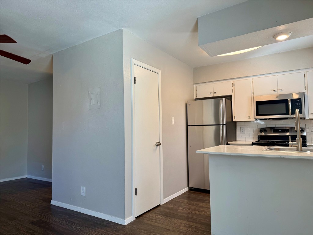 4503 Speedway, Unit 101 Austin, TX 78751 - Photo 3 of 6 a kitchen with stainless steel appliances a refrigerator and a sink