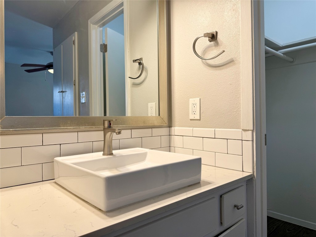 4503 Speedway, Unit 101 Austin, TX 78751 - Photo 5 of 6 a bathroom with a sink and a mirror