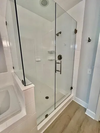 a bathroom with a shower and a sink