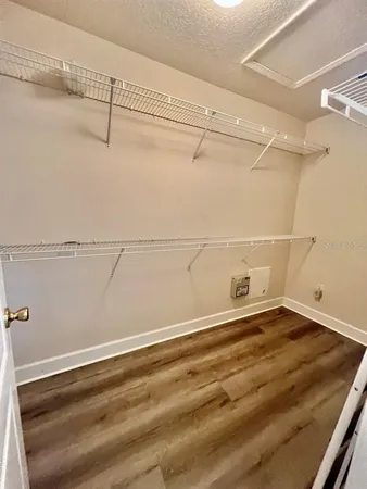 a view of a room with racks on the wall
