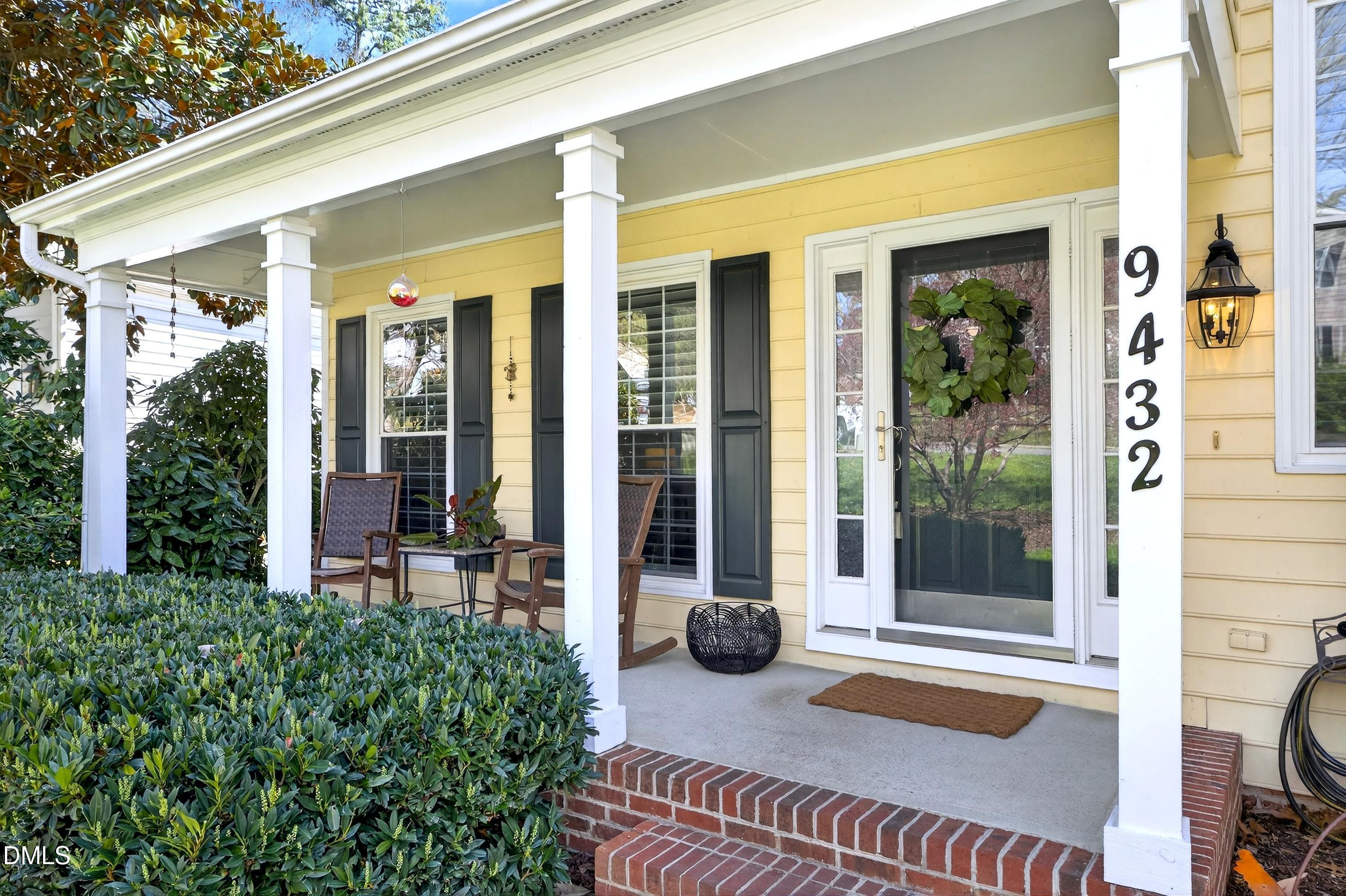9432 Cartersville Court Raleigh, NC 27617 - Photo 4 of 66 a front view of a house with a porch