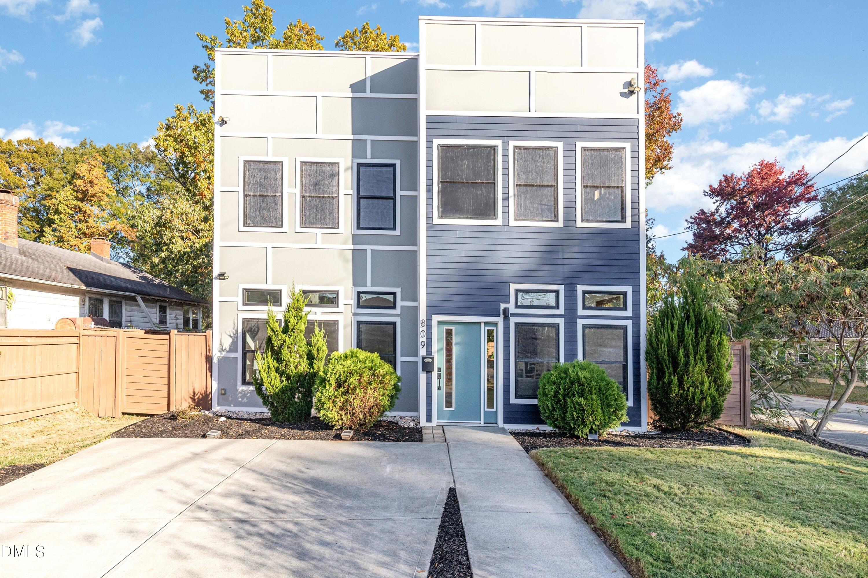 a view of a brick building next to a yard