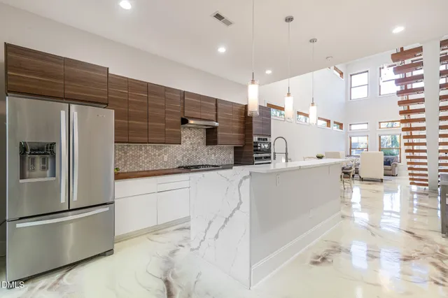 a dining room with furniture and entryway