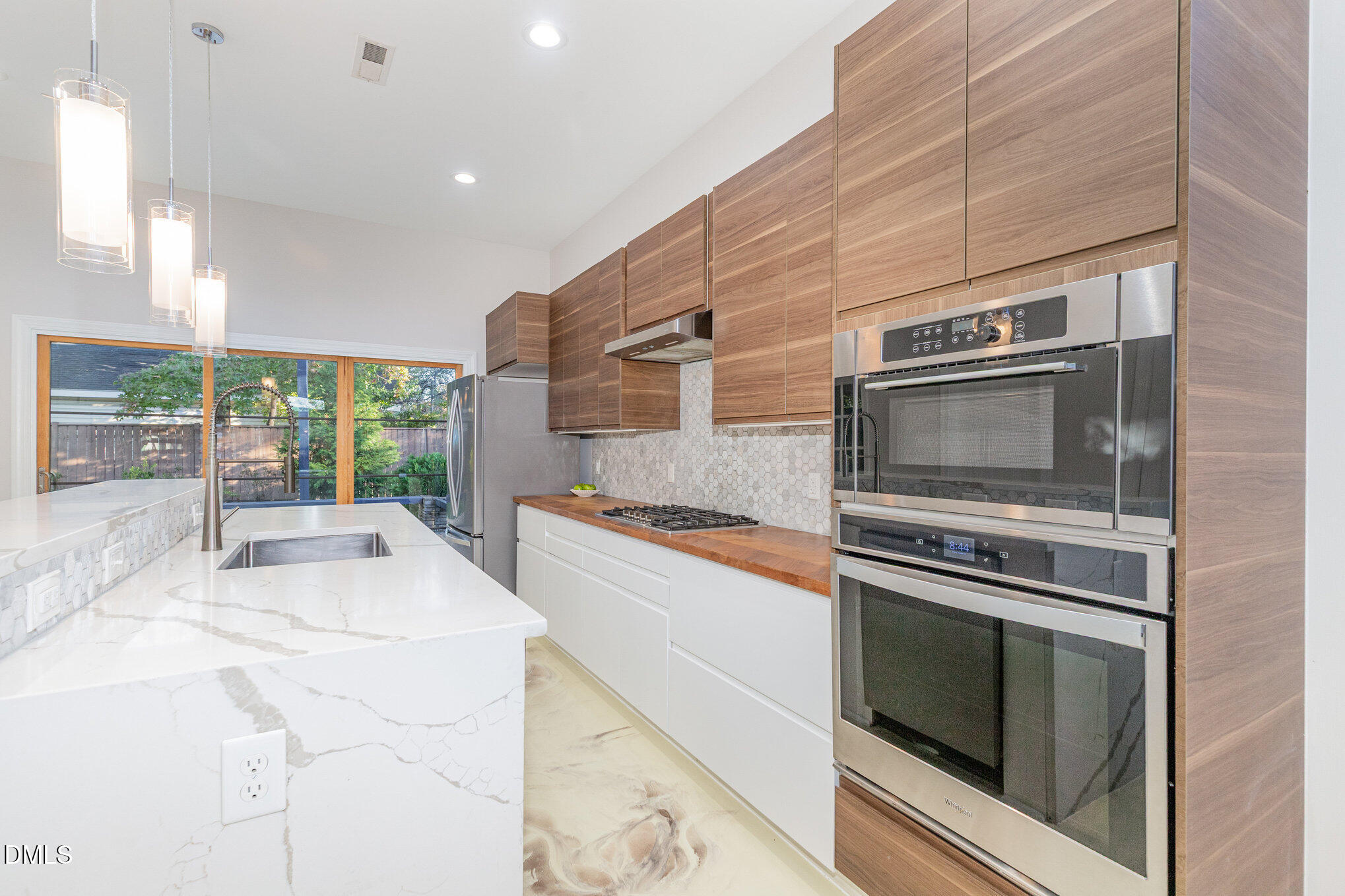809 Drew Street Durham, NC 27701 - Photo 12 of 38 a kitchen with stainless steel appliances a stove and a microwave