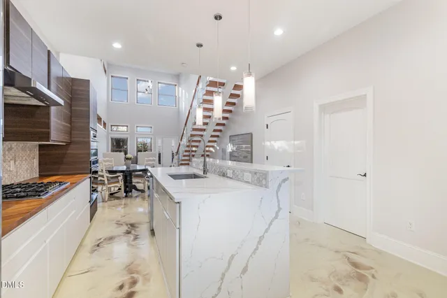 a kitchen with stainless steel appliances a stove and a microwave