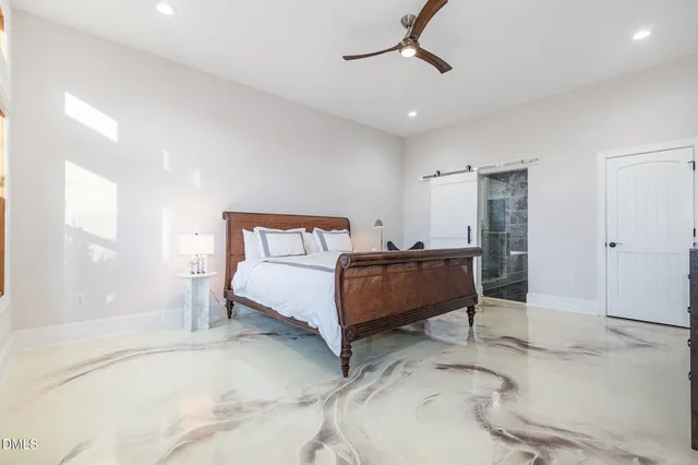 a kitchen with stainless steel appliances kitchen island granite countertop a stove and a sink