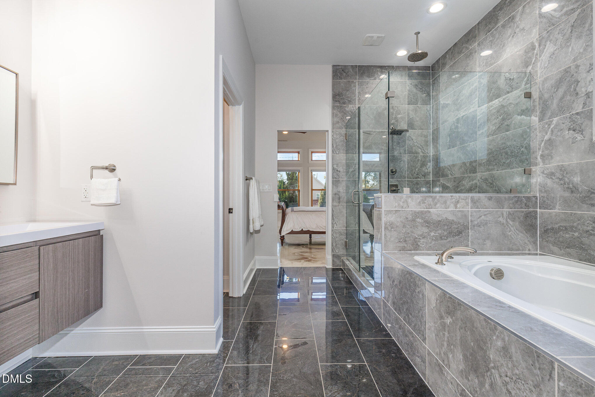 809 Drew Street Durham, NC 27701 - Photo 18 of 38 a bathroom with a bathtub and a shower