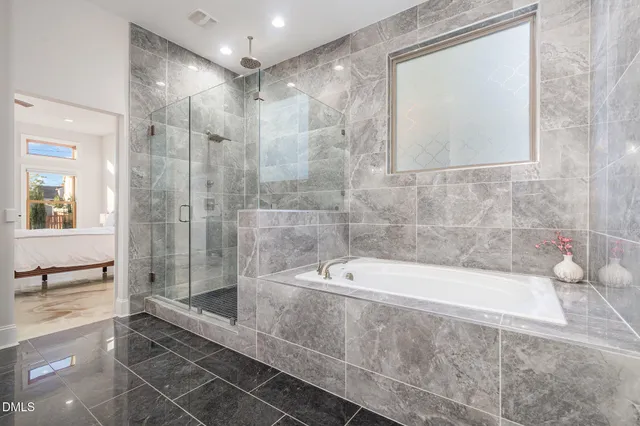 a bedroom with a bed a table and chair