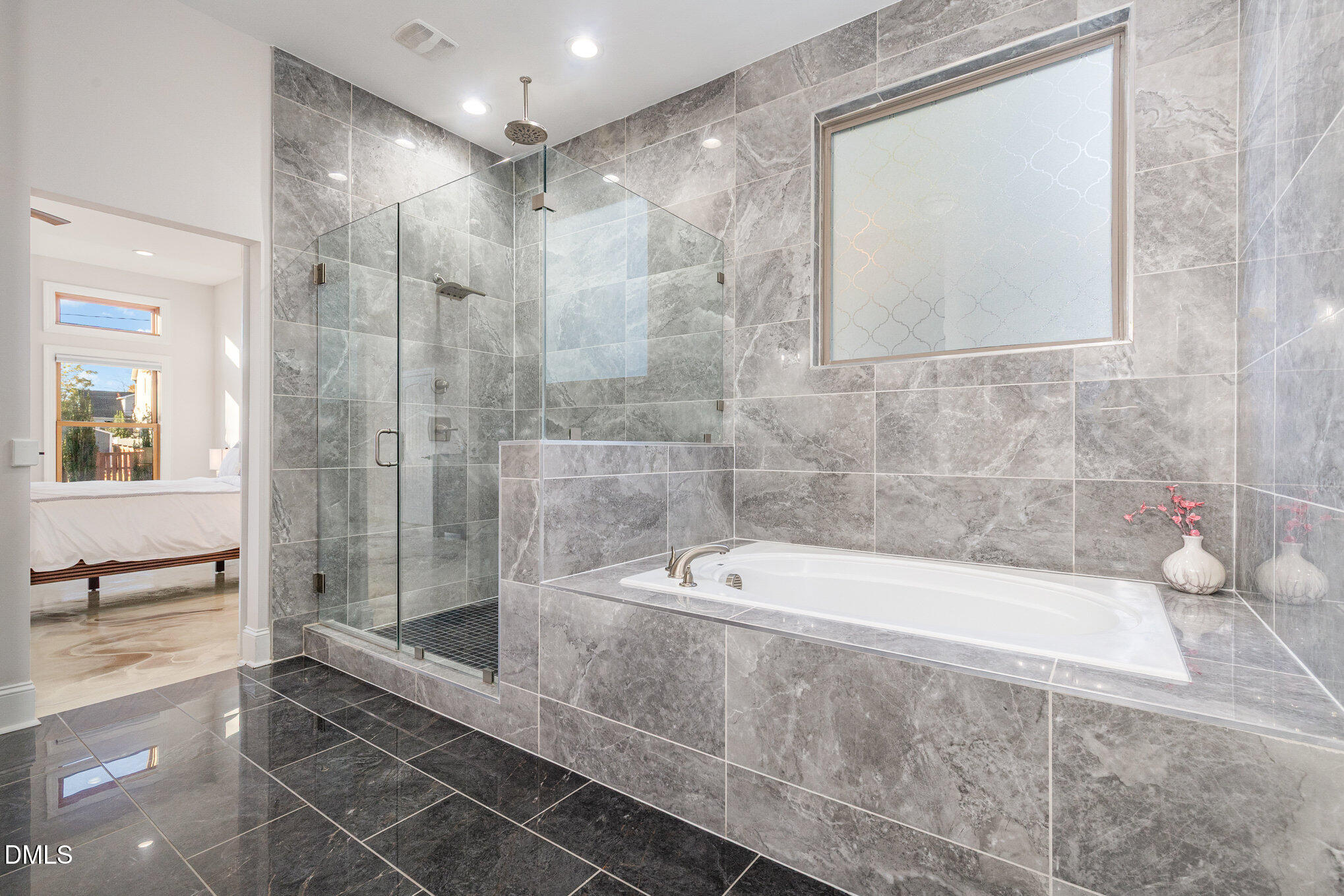 809 Drew Street Durham, NC 27701 - Photo 19 of 38 a bathroom with a bathtub and a shower