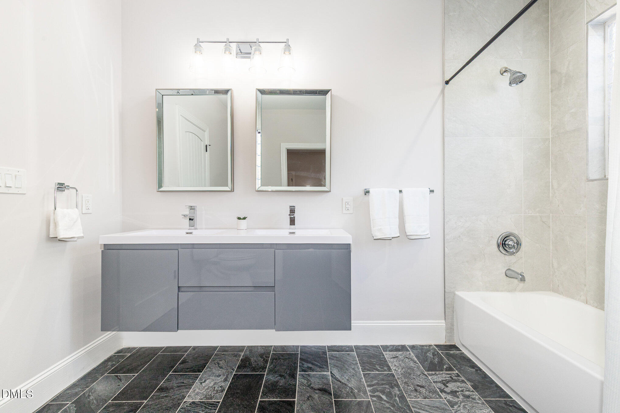 809 Drew Street Durham, NC 27701 - Photo 22 of 38 a bathroom with a bathtub and a sink