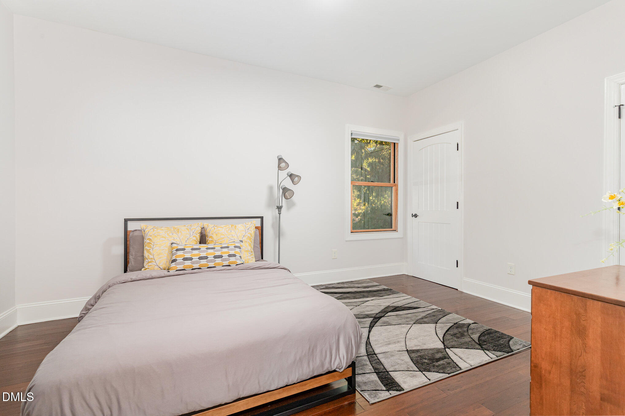 809 Drew Street Durham, NC 27701 - Photo 28 of 38 a bedroom with a bed and a window