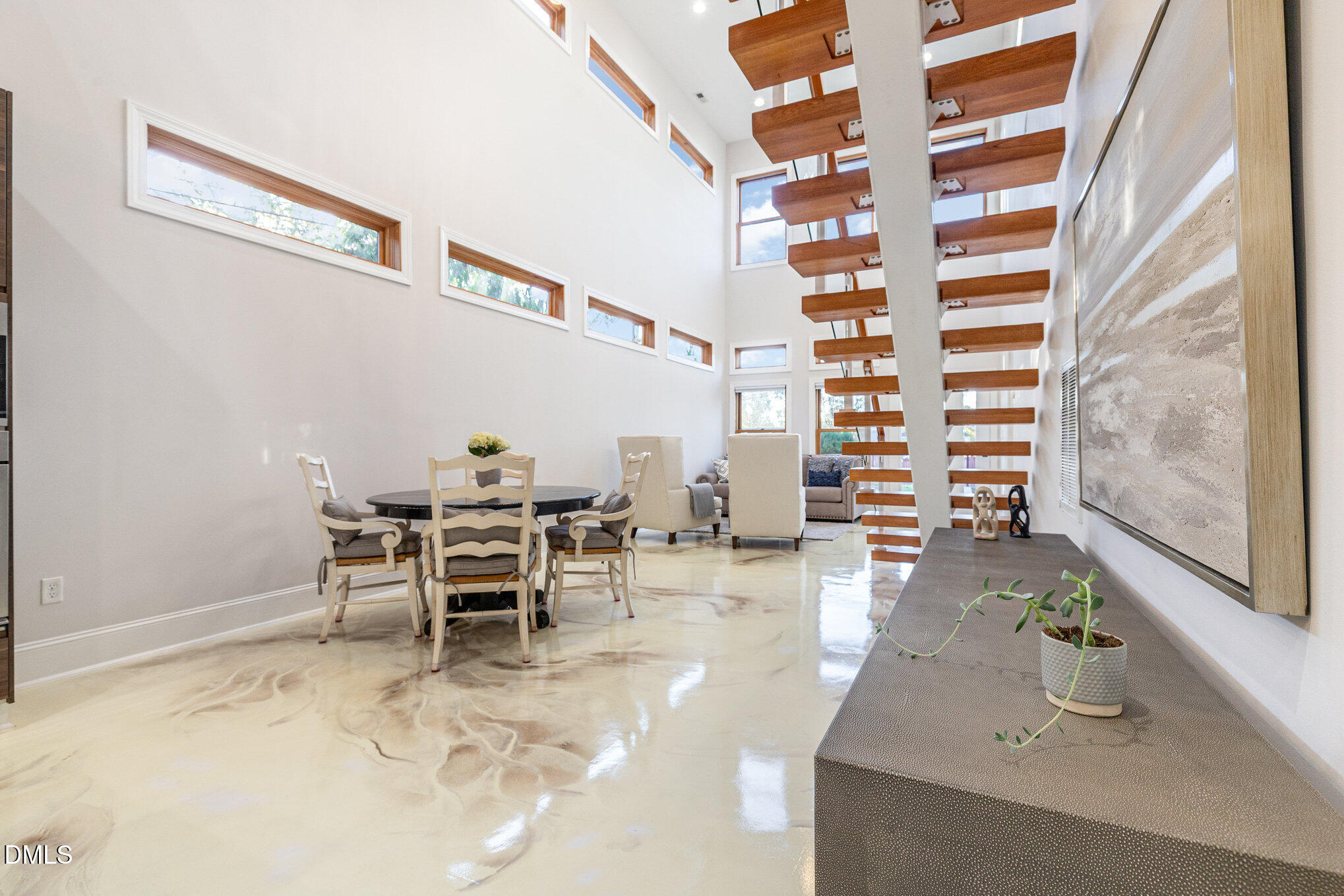 809 Drew Street Durham, NC 27701 - Photo 7 of 38 a dining room with furniture and a chandelier