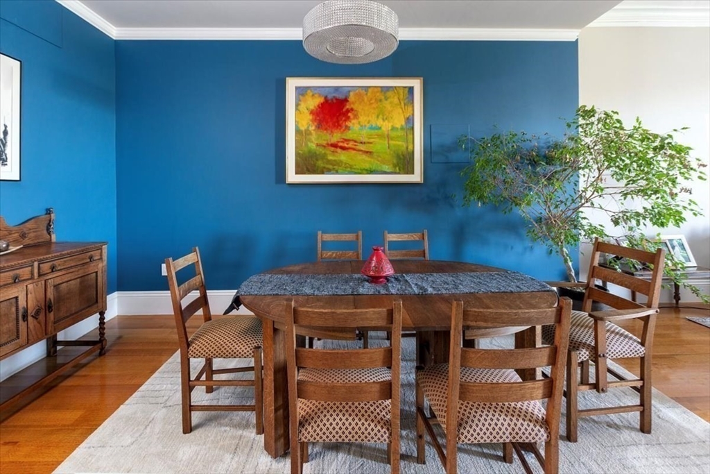214 Beacon Street Boston, MA 02116 - Photo 9 of 21 a view of a dining room with furniture and wooden floor