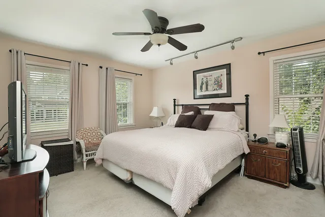 a bedroom with bed and window