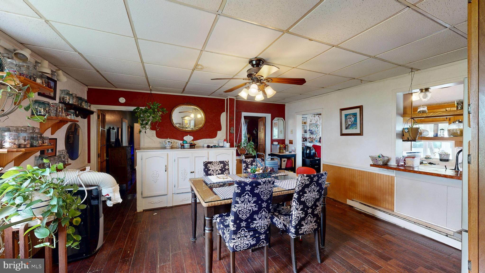 5403 Willow Grove Road Camden Wyoming, DE 19934 - Photo 11 of 44 a view of a dining room with furniture and wooden floor