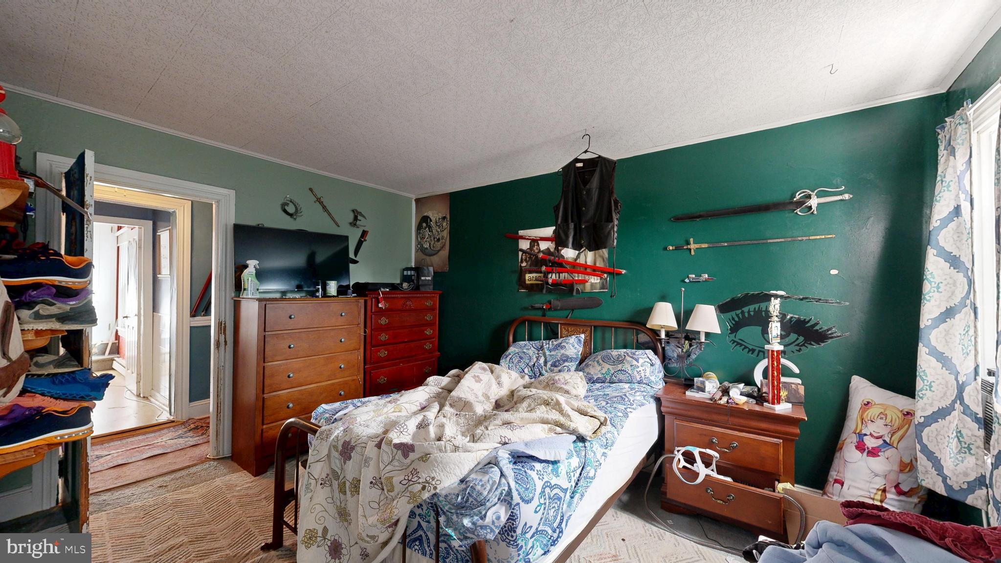 5403 Willow Grove Road Camden Wyoming, DE 19934 - Photo 19 of 44 a bedroom with a bed closet and a flat tv screen