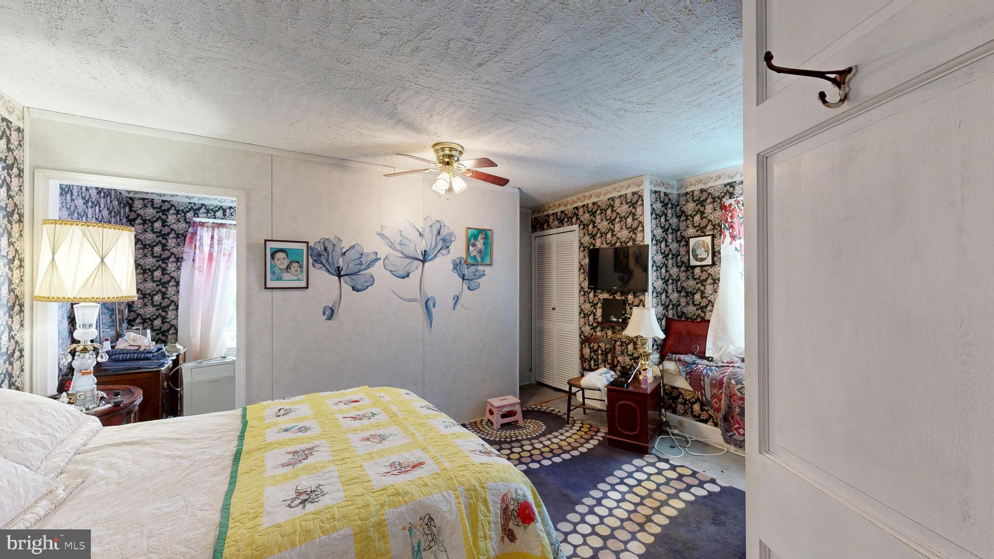 5403 Willow Grove Road Camden Wyoming, DE 19934 - Photo 3 of 44 a bedroom with a bed and wooden floor