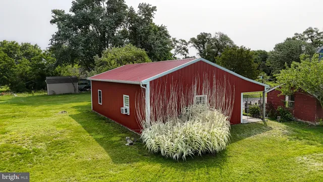 a view of a house with a yard and lake