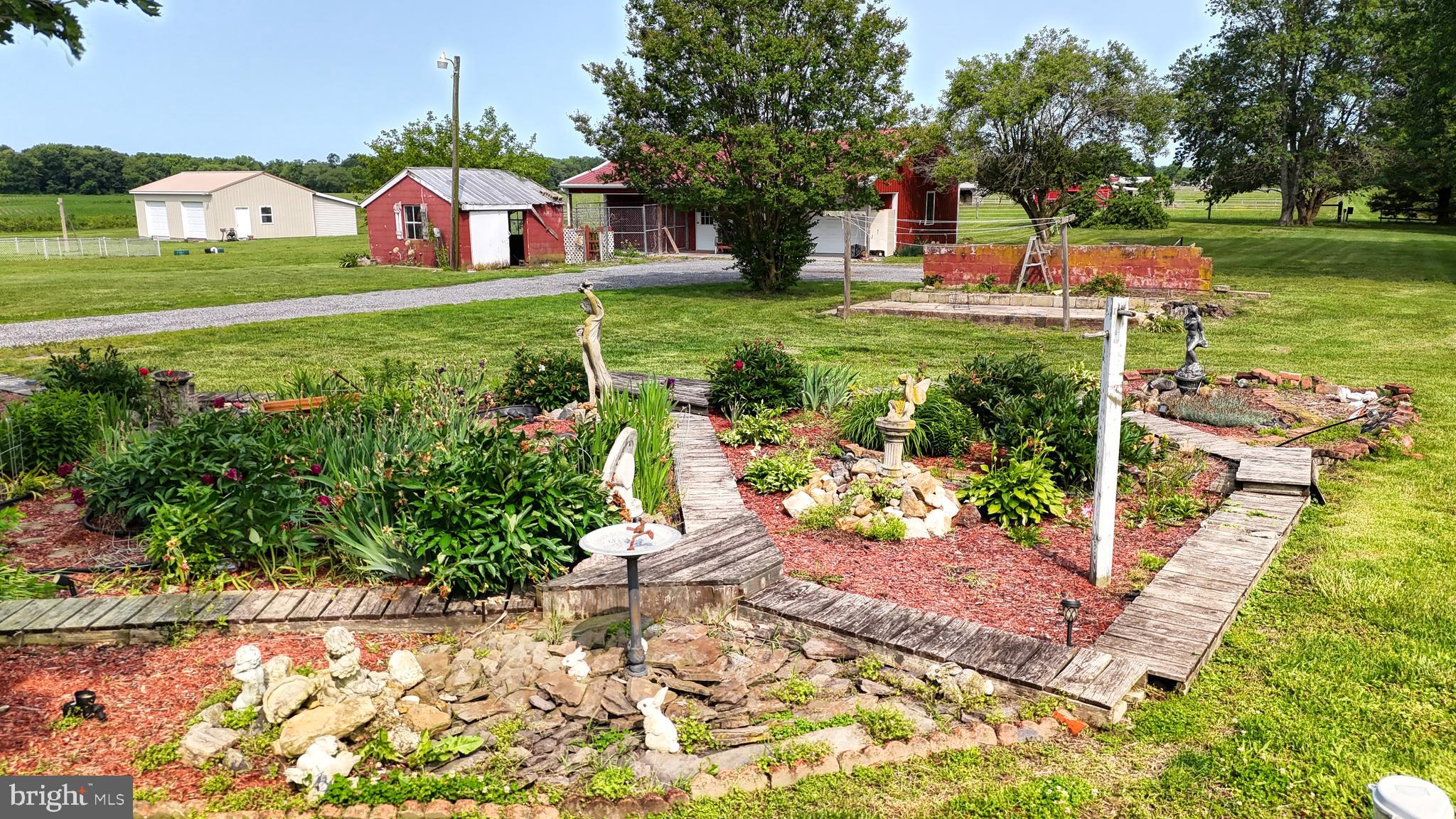 5403 Willow Grove Road Camden Wyoming, DE 19934 - Photo 36 of 44 a front view of a house with garden