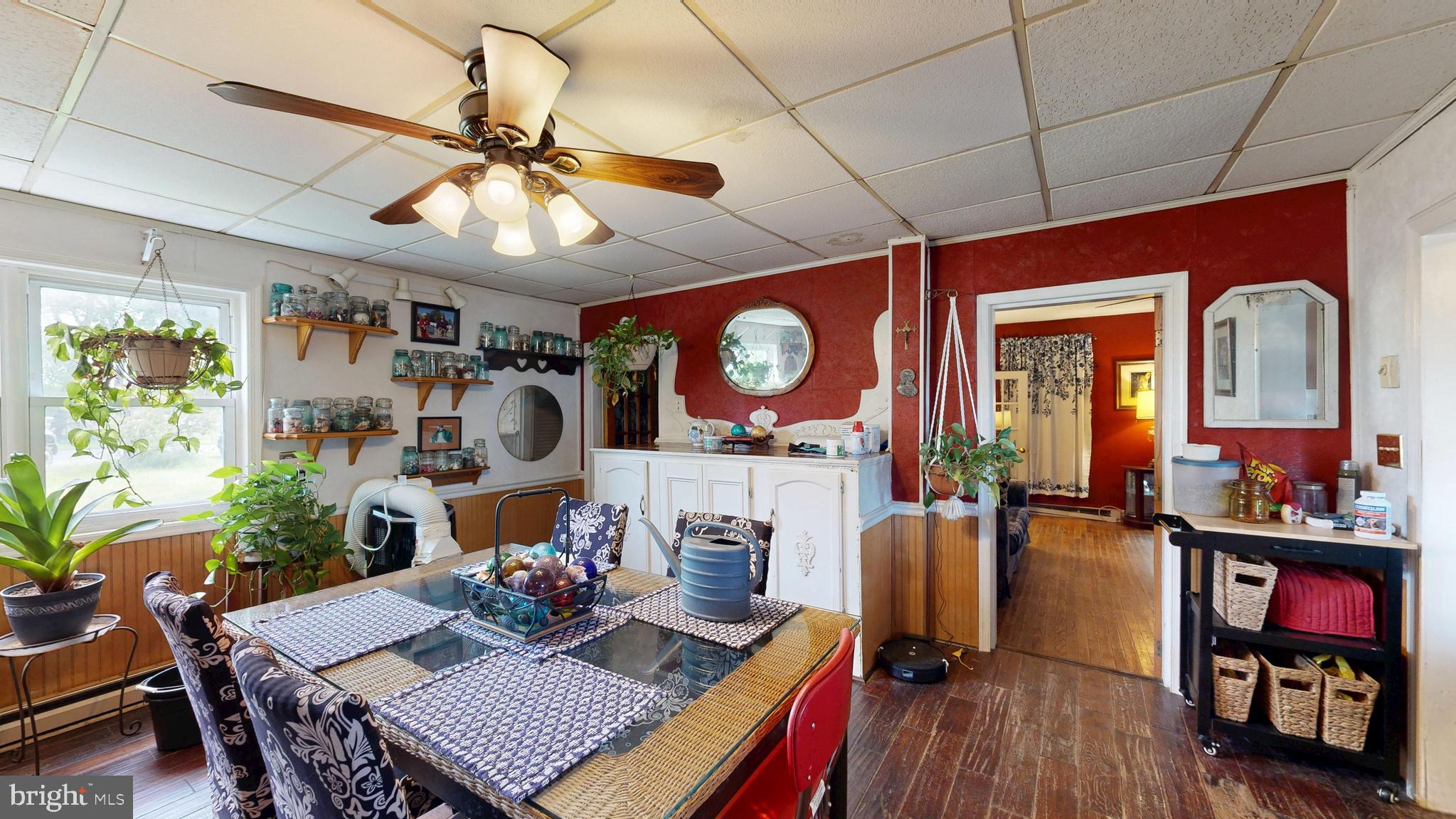 5403 Willow Grove Road Camden Wyoming, DE 19934 - Photo 39 of 44 a view of a dining room with furniture a chandelier and wooden floor