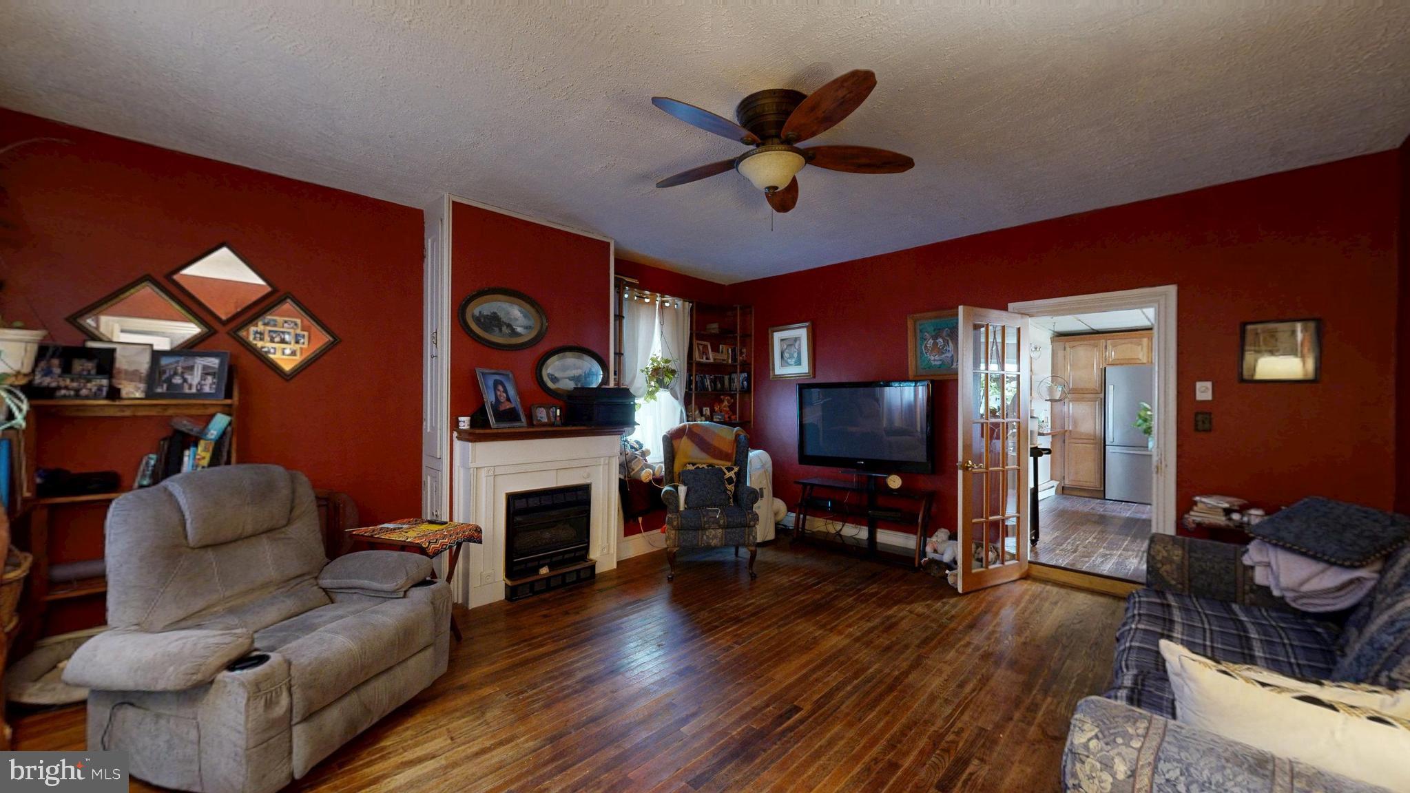 5403 Willow Grove Road Camden Wyoming, DE 19934 - Photo 5 of 44 a living room with furniture fireplace and flat screen tv