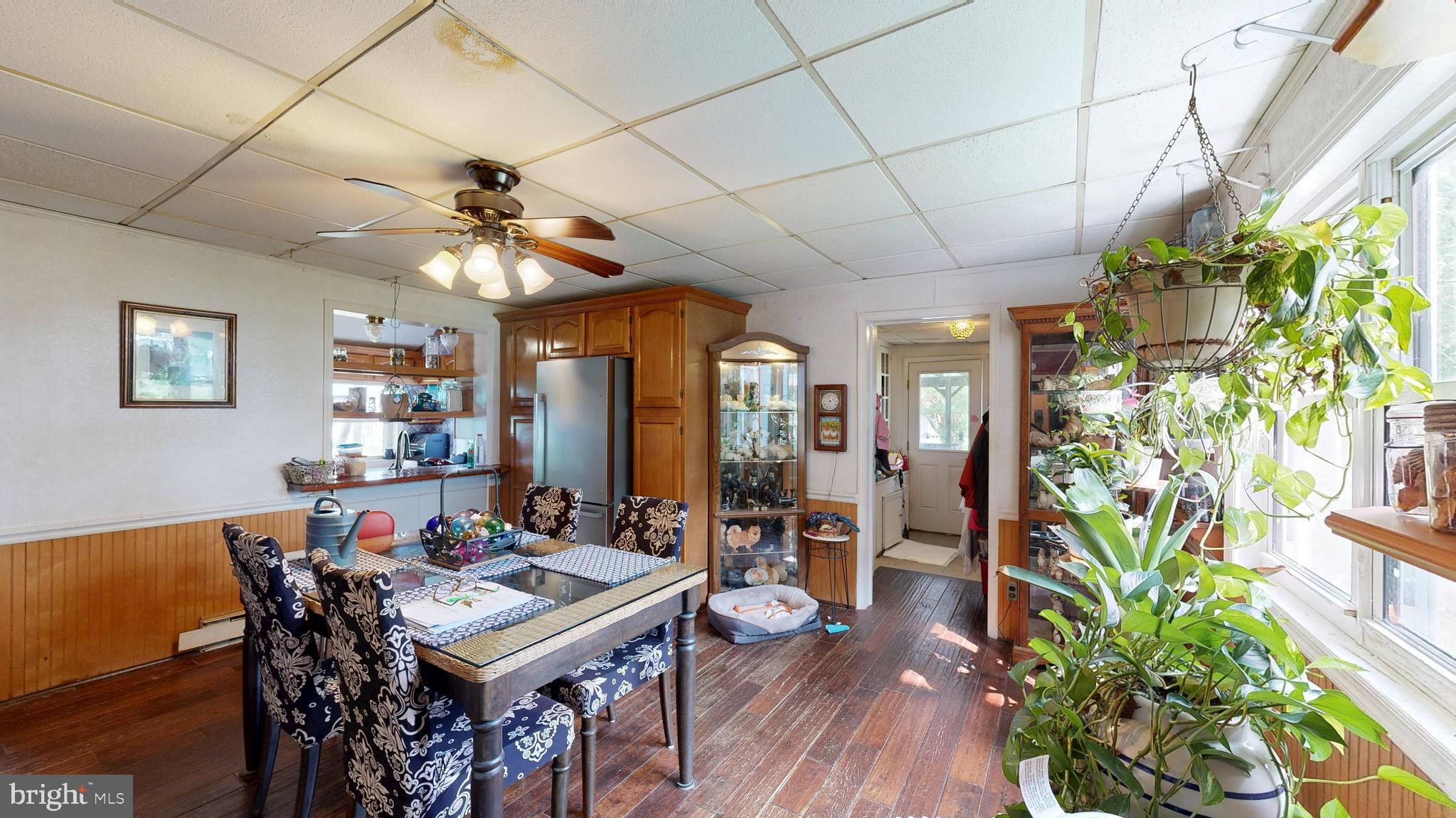 5403 Willow Grove Road Camden Wyoming, DE 19934 - Photo 10 of 44 a view of a dining room with furniture window and wooden floor