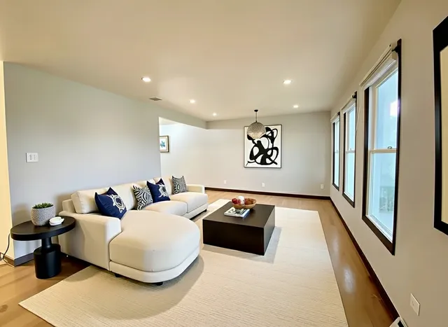 a living room with furniture and a rug