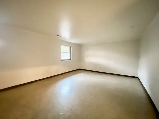 a bathroom with a sink toilet and mirror
