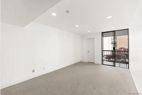 an empty room with sliding glass door