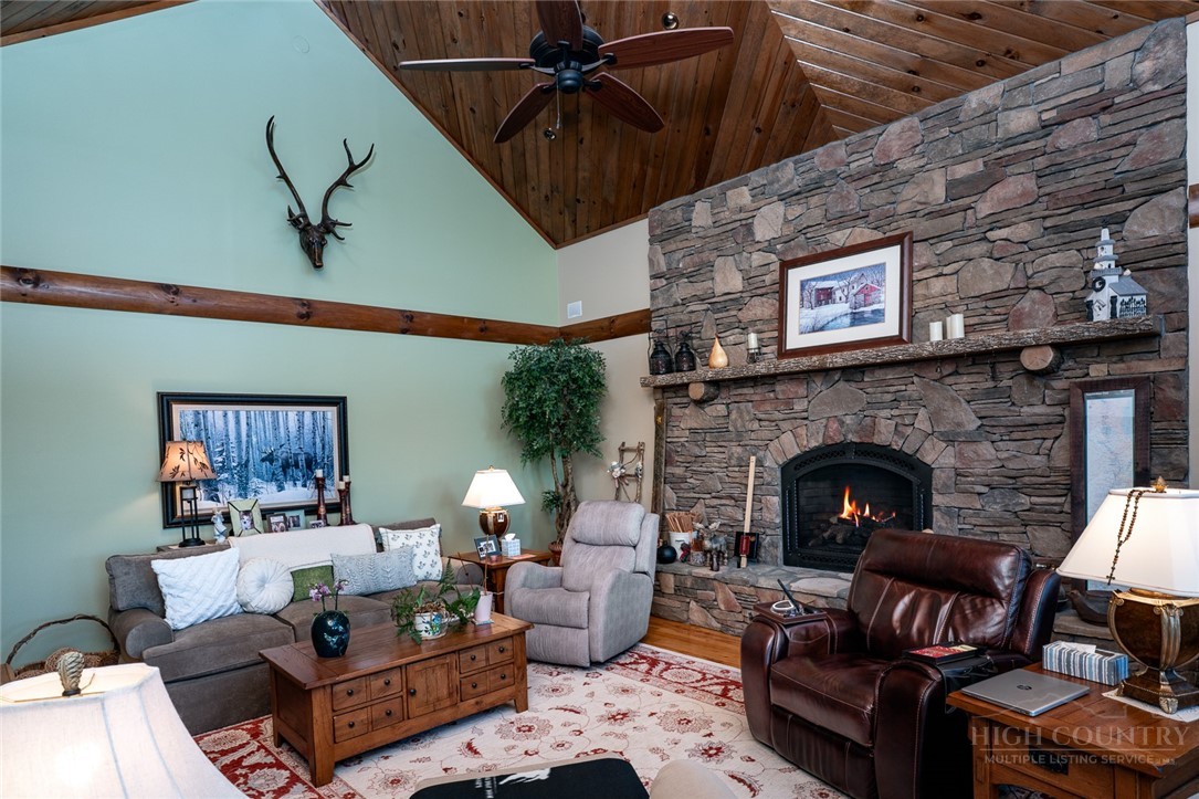 171 Camp Davis Road Banner Elk, NC 28604 - Photo 15 of 48 a living room with furniture and a fireplace