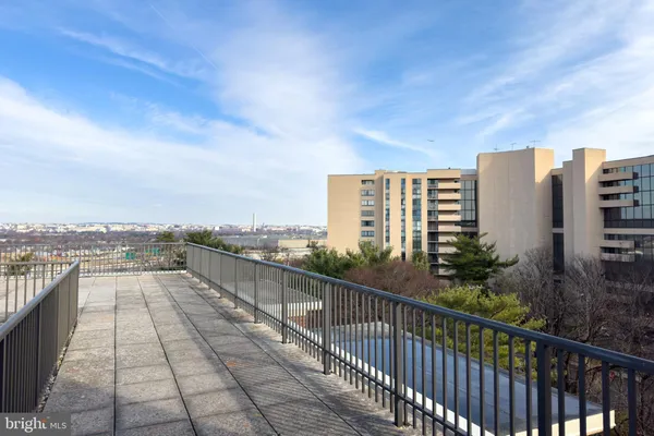 a view of a balcony with city view