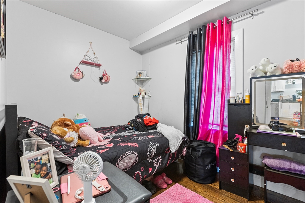 88 Gordon Avenue, Unit 2 Boston, MA 02136 - Photo 13 of 27 a bedroom with a bed and a bed