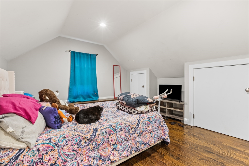 88 Gordon Avenue, Unit 2 Boston, MA 02136 - Photo 14 of 27 a bedroom with a bed and wooden floor