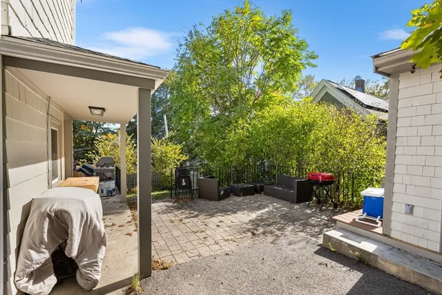 an aerial view of a house with outdoor space