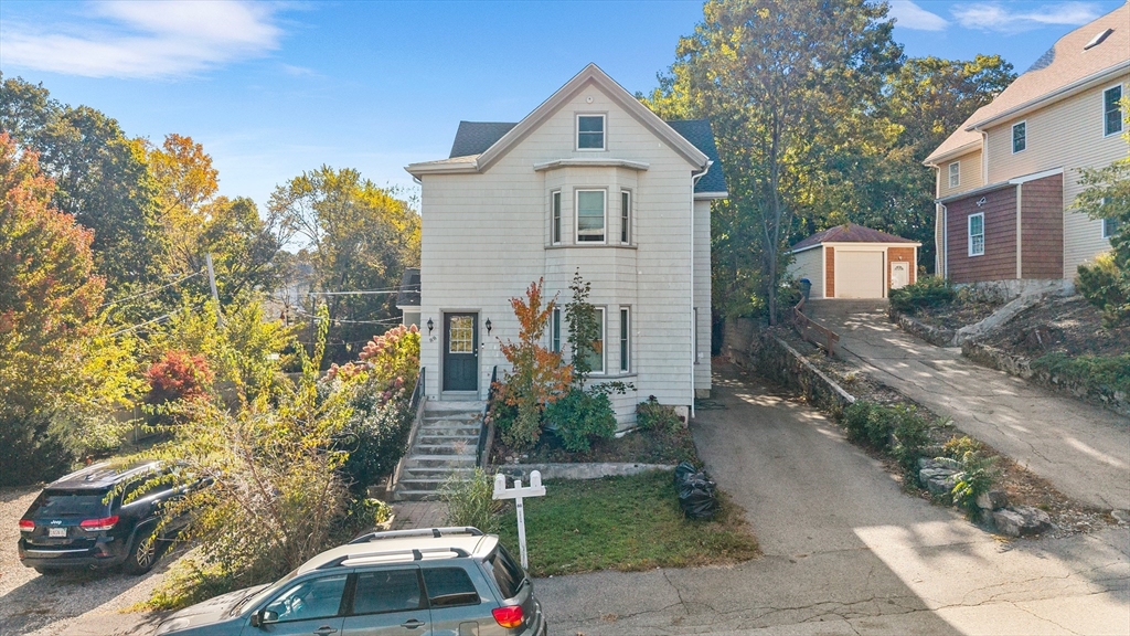 88 Gordon Avenue, Unit 2 Boston, MA 02136 - Photo 21 of 27 a front view of a house with a yard
