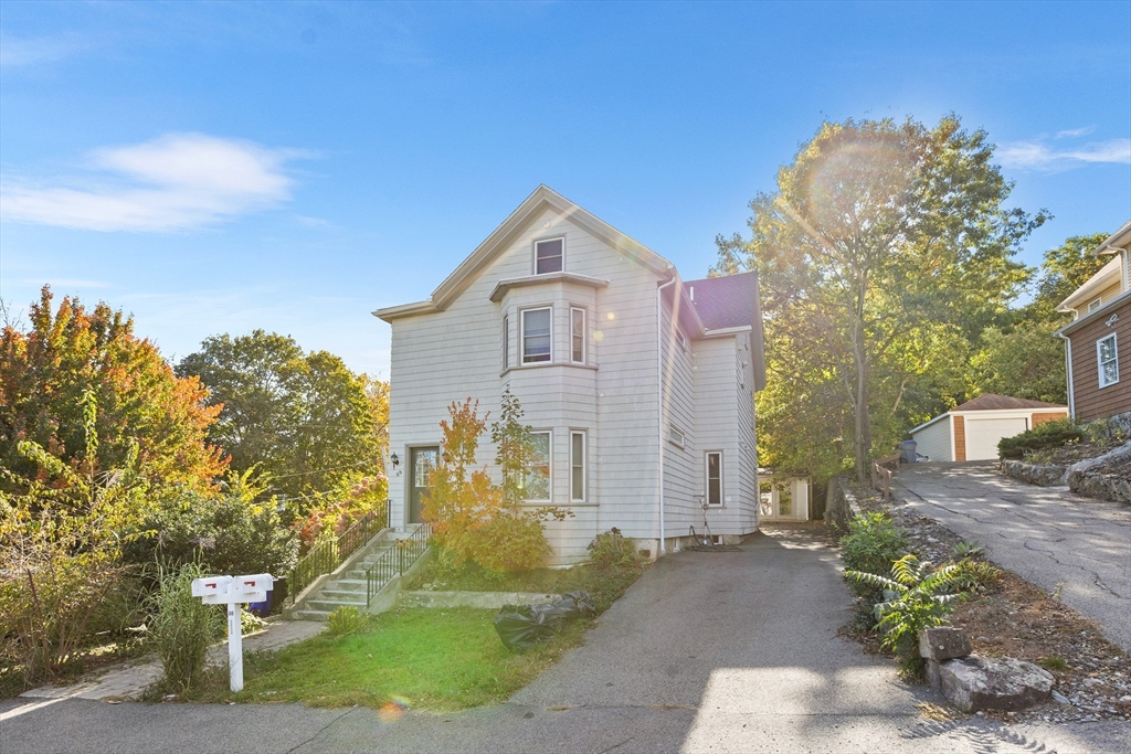 88 Gordon Avenue, Unit 2 Boston, MA 02136 - Photo 23 of 27 a front view of a house with a yard